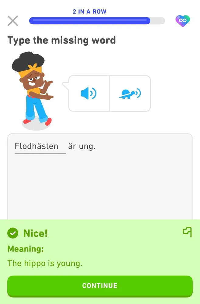 A screenshot from DuoLingo with the Swedish to English translation of “the hippo is young.”