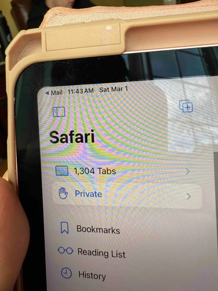 A picture of an iPad of a Safari browser with 1,304 open tabs.