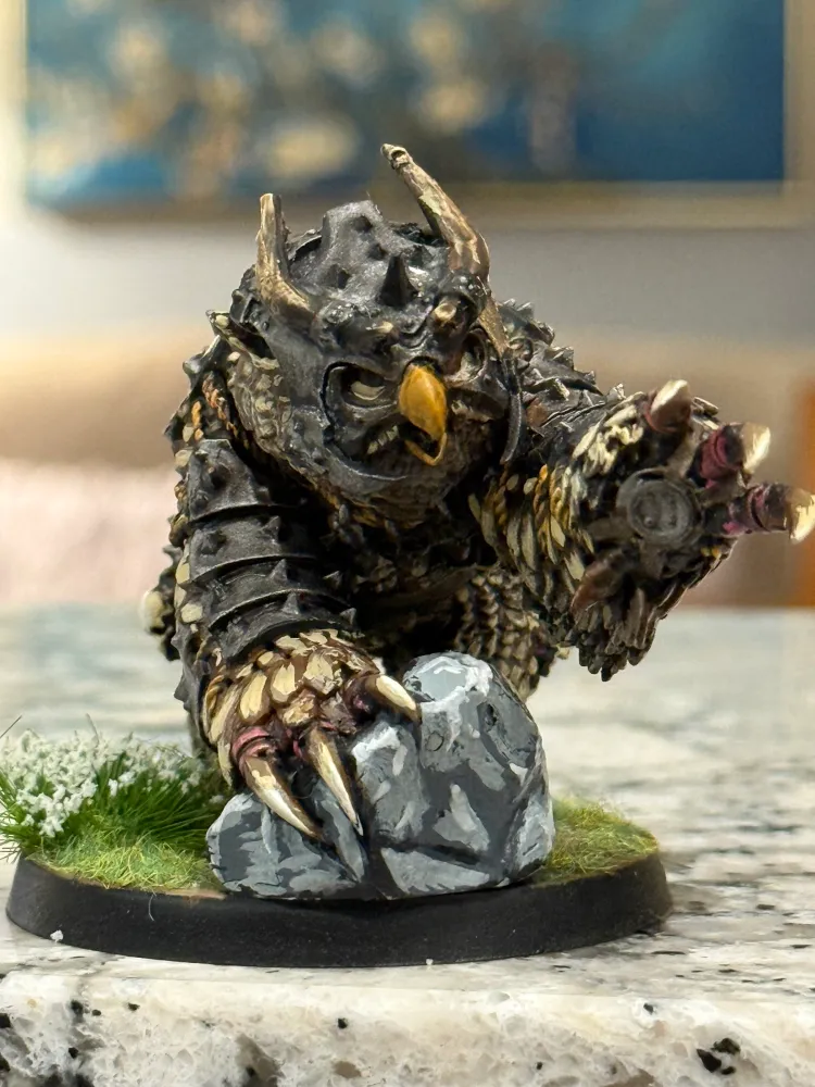 A painted owlbear miniature