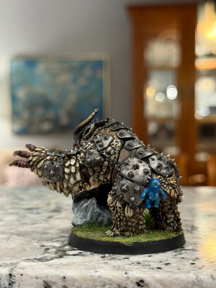 A painted owlbear miniature