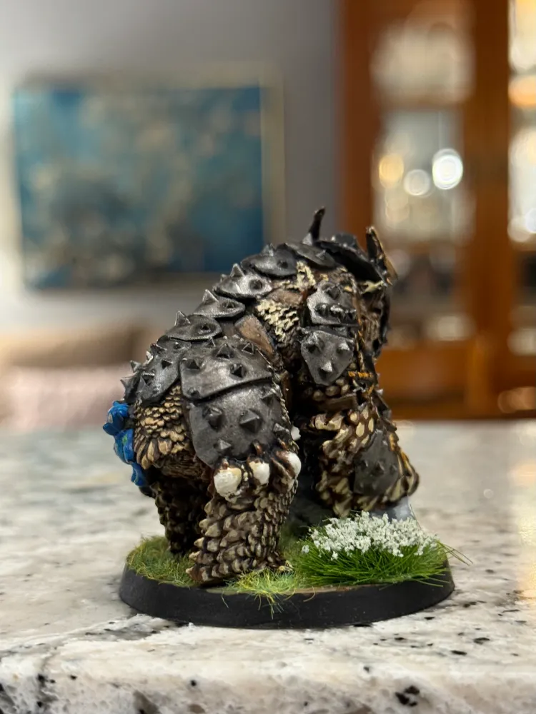 A painted owlbear miniature