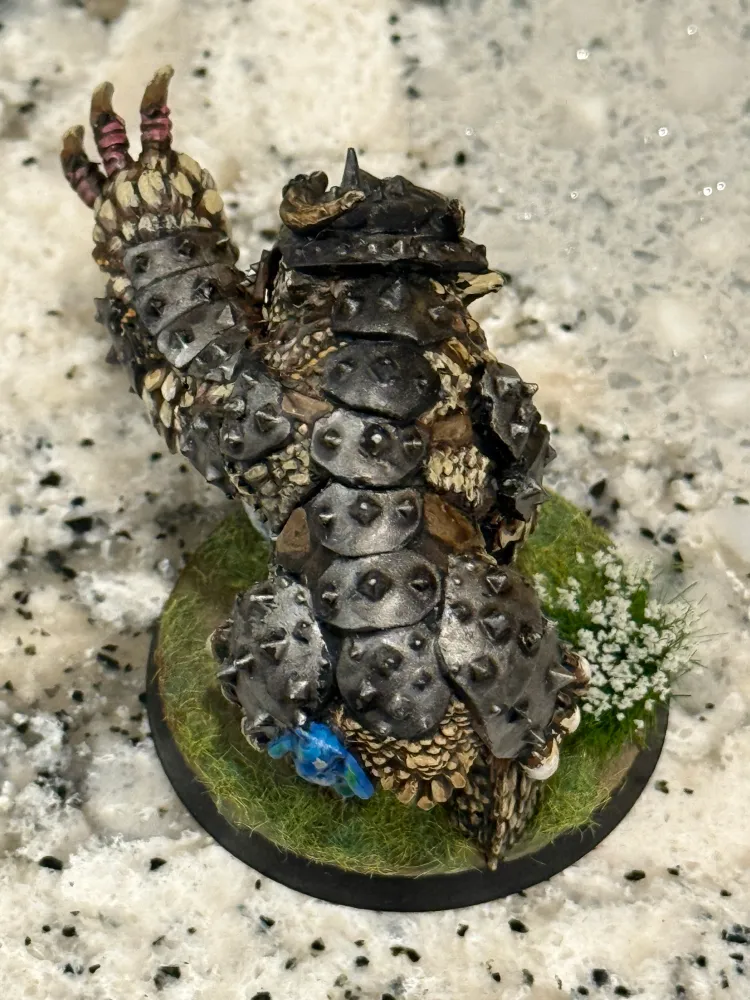 A painted owlbear miniature
